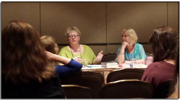 Morgan speaking with other authors at RT16 Las Vegas